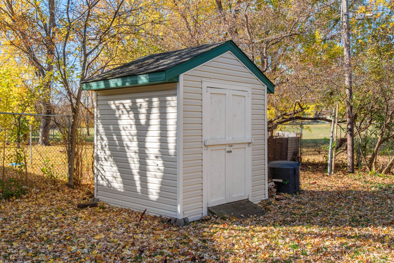 Crafting Captivating Headlines: Your awesome post title goes here A quaint backyard shed surrounded by autumn foliage, ideal for storage solutions.